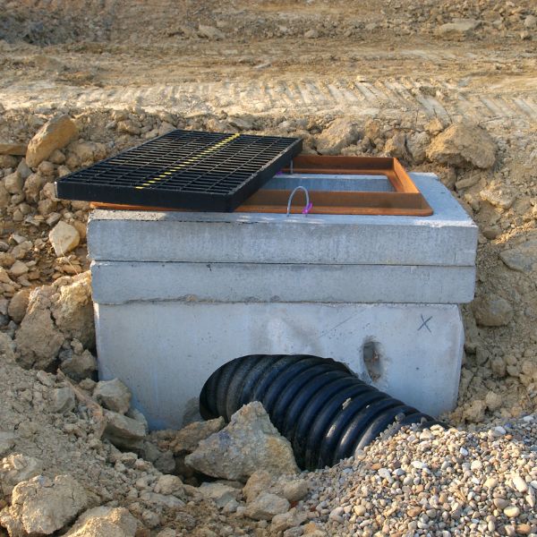 New stormwater drainage pit installation in Western Sydney with pipe connection by West Sydney Landscapes