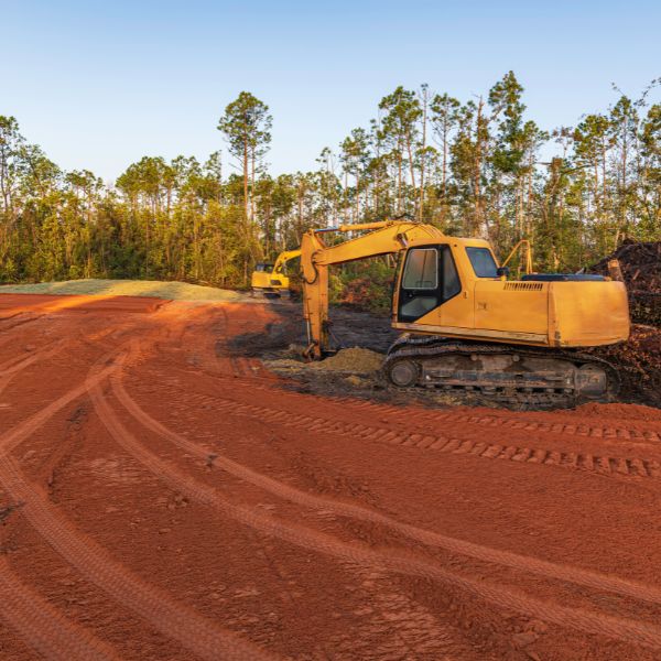 Land clearing in Western Sydney with excavator removing soil and shaping rural property for development by West Sydney Landscapes.